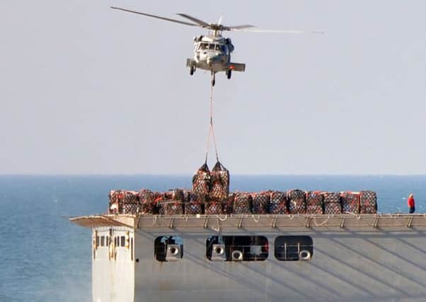 About 2,500 tonnes of stores were transferred by helicopter from the USNS Medgar Evers to USS Harry S Truman. in an operation that HMS Defender took part in
