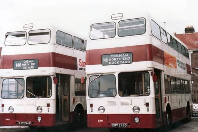 Two Leyland Atlanteans pose alongside the rear of Eastney depot in 1980