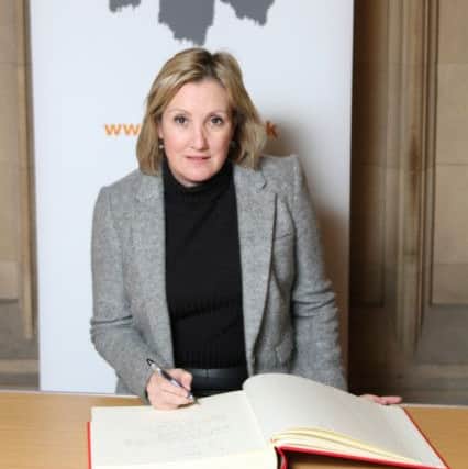 Gosport MP Caroline Dinenage signing the Holocaust Educational Trusts Book of Commitment