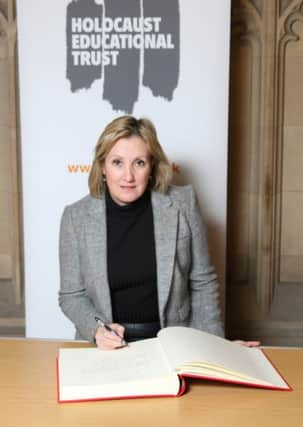 Gosport MP Caroline Dinenage signing the Holocaust Educational Trusts Book of Commitment