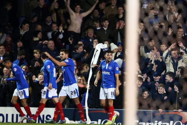 The Pompey players and fans celebrate Gary Roberts opener against Ipswich on Tuesday night Picture: Joe Pepler