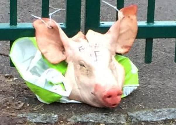 The pig's head left tied to the Madani Academy gates