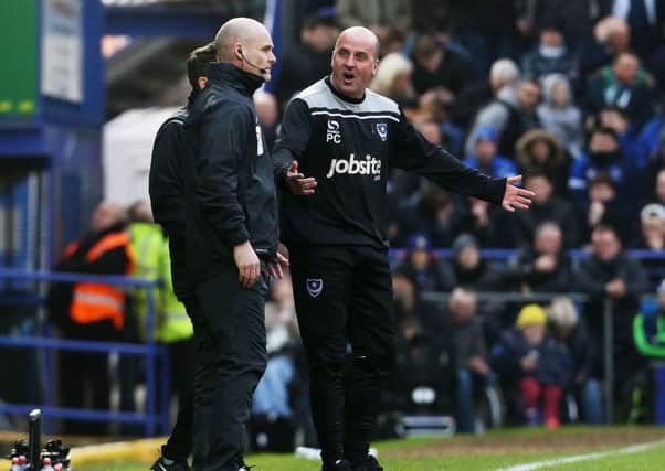 Pompey manager Paul Cook remonstrates with the fourth official during today's game Picture: Joe Pepler