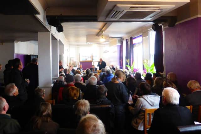 The packed meeting
