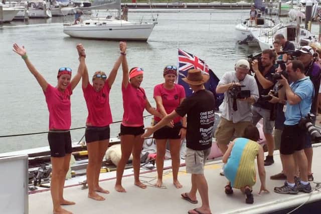 The Coxless Crew - a group of female adventurers - celebrate in Cairns, Australia, after rowing their 29 foot boat, Doris, more than 9,200 miles across the Pacific Ocean. Picture: Sarah Moshman, Losing Sight of Shore / PA Wire