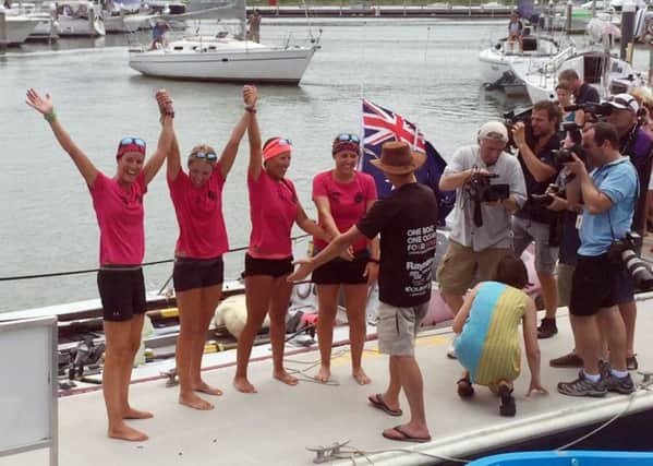 The Coxless Crew - a group of female adventurers - celebrate in Cairns, Australia, after rowing their 29 foot boat, Doris, more than 9,200 miles across the Pacific Ocean. Picture: Sarah Moshman, Losing Sight of Shore / PA Wire