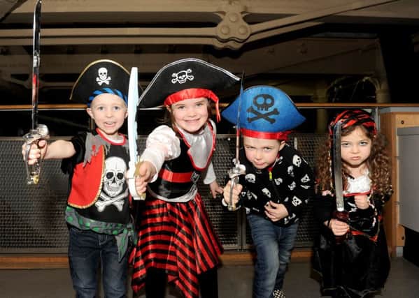 Children from Fairfield Infant School in Havant were dressed as pirates for an activities day at Action Stations in Portsmouth Historic Dockyard. 
From left, Arthur Cullum, six,, Zoe Healey, six,  Jesse Heath, five, and Ellayna Cutler, five 

Picture: Sarah Standing (160118-9559)