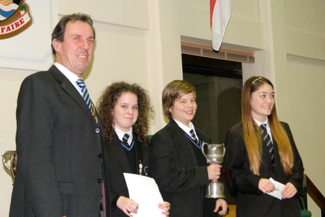 SPEAKING OUT From left: Fareham Rotary President Bob Mussellwhite with Teghan Neat, Thomas Anderson and Charlotte Plummer from Fareham Academy