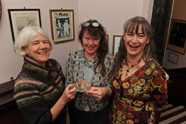 Jane Mee, Deborah Richards, and Katy Ball from Portsmouth's museum service, collecting the award for best exhibition
