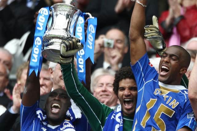 Slyvain Distin, right, celebrates winning the FA Cup in 2008