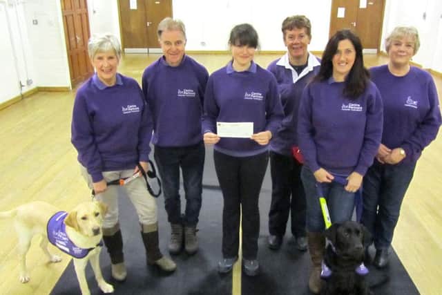 From left, Canine Partners volunteers Chris Seward and Tim Seward, puppy trainer Hayley Telling, and volunteers Christine Turner, Lynne Candler, and Lorraine Snape. The charity was awarded Â£250 from the Community Cashpot of the Fareham View - a sister paper of The News