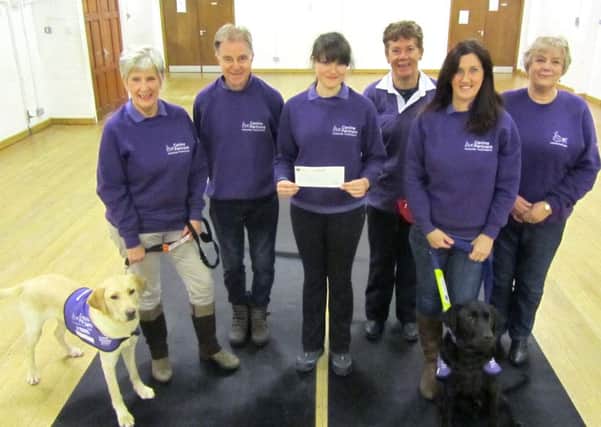 From left, Canine Partners volunteers Chris Seward and Tim Seward, puppy trainer Hayley Telling, and volunteers Christine Turner, Lynne Candler, and Lorraine Snape. The charity was awarded Â£250 from the Community Cashpot of the Fareham View - a sister paper of The News