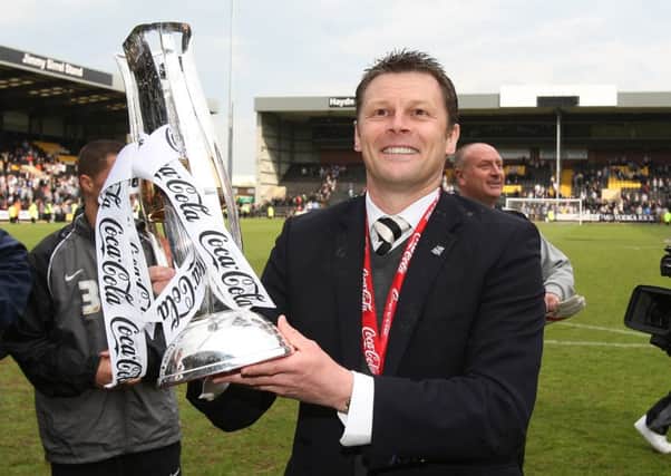 Steve Cotterill celebrates his League Two success with Notts County