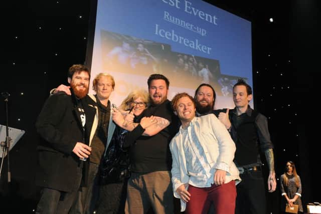 The Icebreaker team receive their runner-up trophy in the Best Event category at the WOW247 Awards from Caroline Sharman of the New Theatre Royal