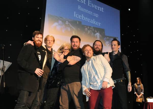 The Icebreaker team receive their runner-up trophy in the Best Event category at the WOW247 Awards from Caroline Sharman of the New Theatre Royal