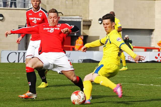 Conor Chaplin nets his maiden Pompey goal at the Globe Arena last season. Picture: Joe Pepler
