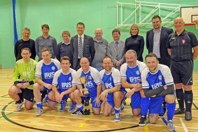 Former Pompey footballer Darren Anderton opened Bay House School's new sports hall. He is pictured with  representatives from the developers, Gosport MP Caroline Dinenage and headteacher Ian Potter with the winning team of the 5 a-side contest, Gosport FC Veterans Picture by: Malcolm Wells (160129-7026)