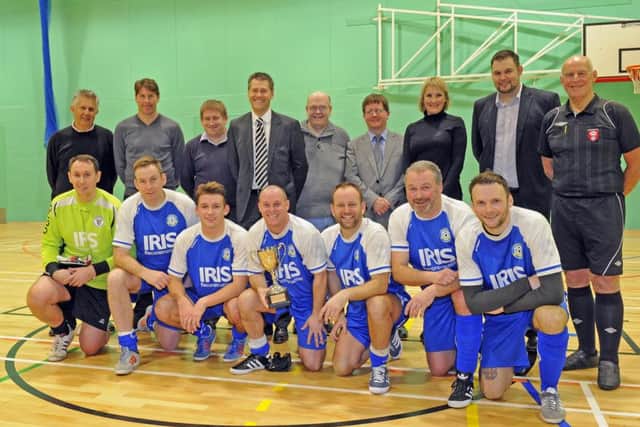 Former Pompey footballer Darren Anderton opened Bay House School's new sports hall. He is pictured with  representatives from the developers, Gosport MP Caroline Dinenage and headteacher Ian Potter with the winning team of the 5 a-side contest, Gosport FC Veterans 

Picture by: Malcolm Wells (160129-7026)