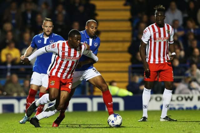 Rommy Boco, centre, made five appearances for Pompey Picture: Joe Pepler