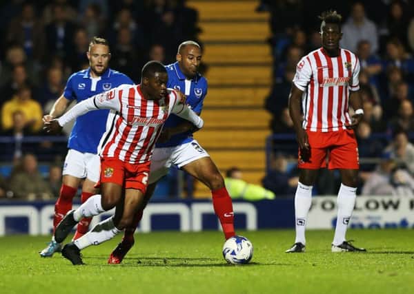 Rommy Boco, centre, made five appearances for Pompey    Picture: Joe Pepler