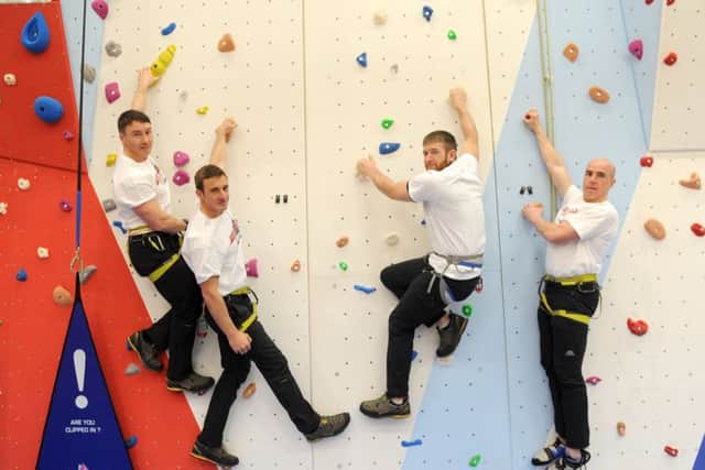 PO Mat Jones, 33, CPL Matt Carter, 30, AET Carl Stubbs, 27, and LPT Ian 'Smokey' Cole, 36, have all completed the Adventure Training Leaders course, and are pictured on the new indoor climbing wallPicture: Sarah Standing (160163-309)