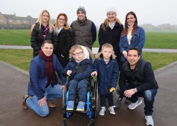 Three Peaks fundraising charity walkers for three children with disabilities front L-R Matt Smith, twins Reuben and Zach Smith, Tim Langley. Back L-R Donna Armstrong, Heidi Guerrier, George Armstrong, Alexia Daniels, Kyla Smith. 

Picture: Paul Jacobs (160121-2)