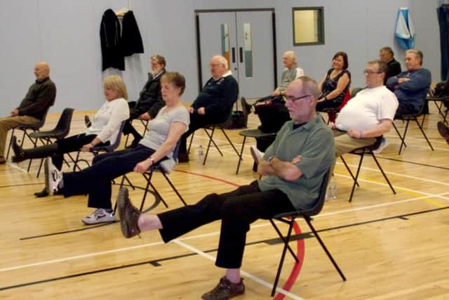 BREATHE EASY Group members keep healthy during an exercise class