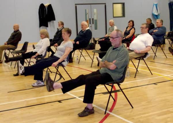 BREATHE EASY Group members keep healthy during an exercise class