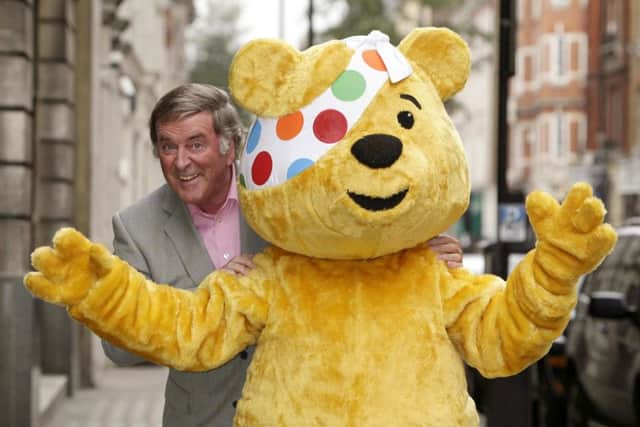 Sir Terry Wogan with Pudsey the bear during a Children in Need photo call. Photo: Yui Mok/PA Wire