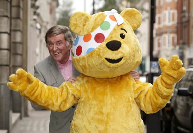Sir Terry Wogan with Pudsey the bear during a Children in Need photo call. Photo: Yui Mok/PA Wire