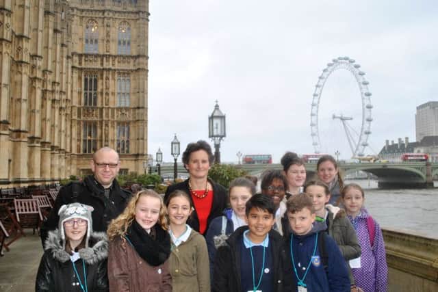 Youngsters from Milton Park Primary with Portsmouth South MP Flick Drummond at the Houses of Parliament