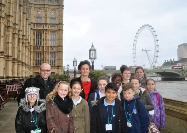 Youngsters from Milton Park Primary with Portsmouth South MP Flick Drummond at the Houses of Parliament