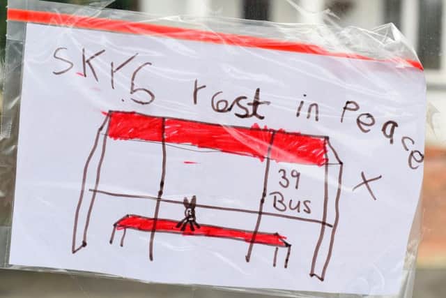 Messages left at the bus stop where the Missy cat used to visit Picture: Solent News & Photo Agency
 UK