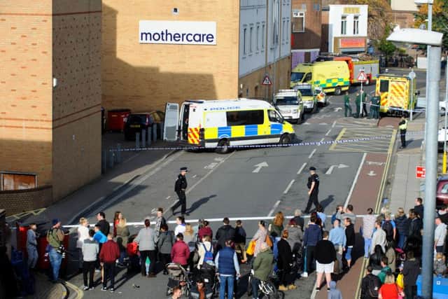 Police cordon off the back of shops in Commercial Road, Portsmouth, on October 31 after reports of a knifeman in Virgin Media Picture: Allan Hutchings (151721-092)