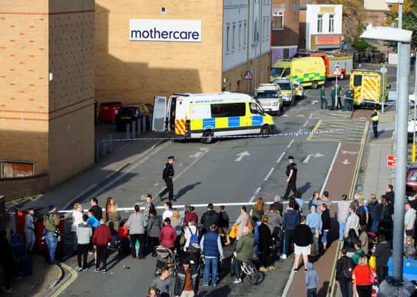 Police cordon off the back of shops in Commercial Road, Portsmouth, on October 31 after reports of a knifeman in Virgin Media 

Picture: Allan Hutchings (151721-092)