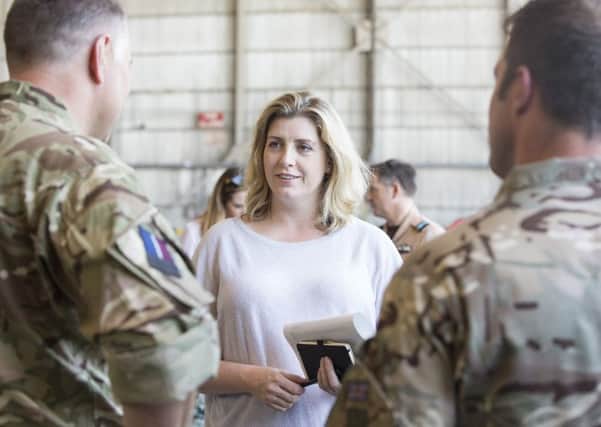 Penny Mordaunt MP talking to personnel at 903 Expeditionary Air Wing (EAW) PHOTO: MoD
