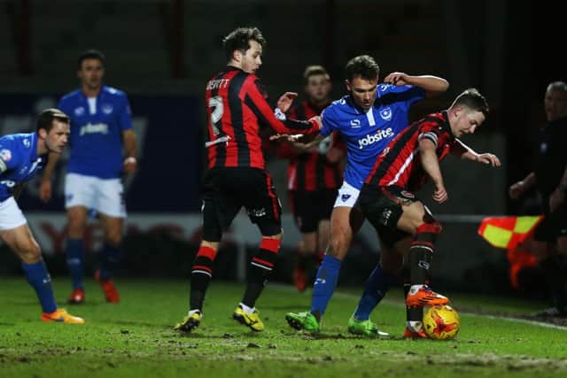 Pompey attacker Kal Naismith challenges for the ball in the Blues' 1-1 draw at Morecambe Picture: Joe Pepler