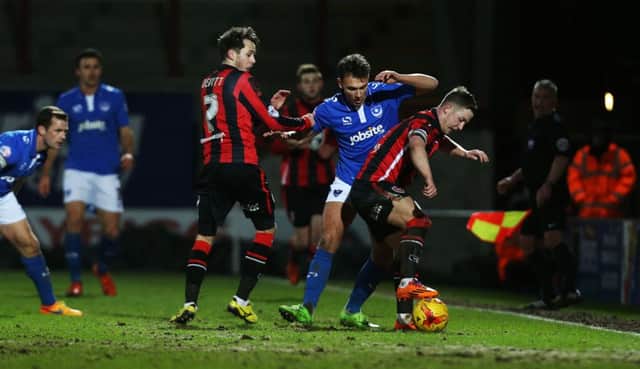 Pompey attacker Kal Naismith challenges for the ball in the Blues' 1-1 draw at Morecambe   Picture: Joe Pepler