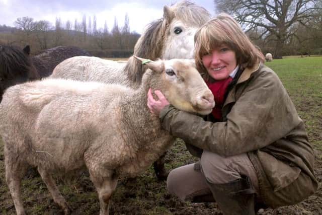 Terena Plowright with her animals at her paddock in Petersfield
