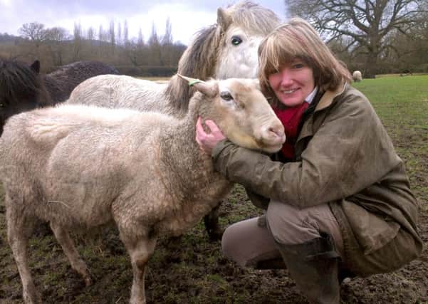 Terena Plowright with her animals at her paddock in Petersfield