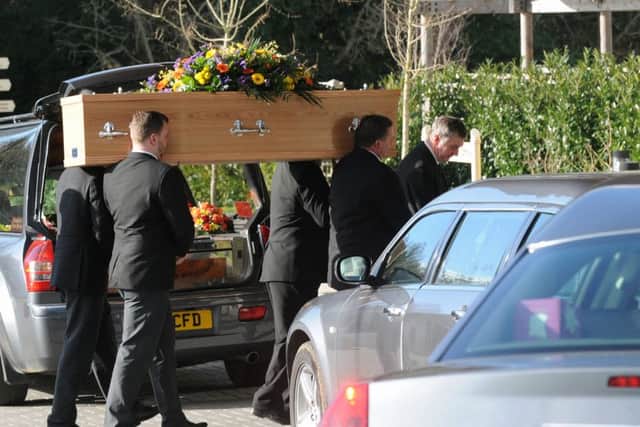 The coffin of Waterlooville businessman Tony Edwards is carried into The Oaks Crematorium Picture: Sarah Standing (160203-1900)