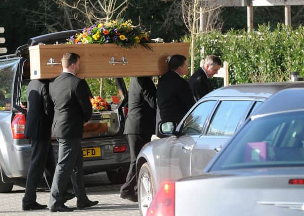 The coffin of Waterlooville businessman Tony Edwards is carried into The Oaks Crematorium 

Picture: Sarah Standing (160203-1900)