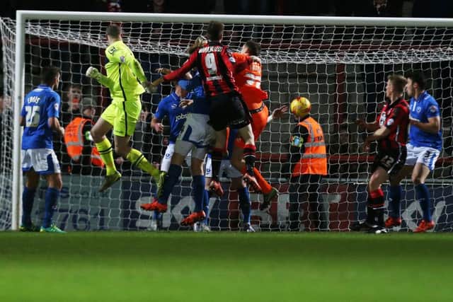 Morecambe goalkeeper Barry Roche heads home the  Shrimps equaliser at the Globe Arena deep into Stoppage-time Picture: Joe Pepler