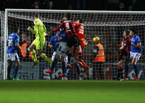 Morecambe goalkeeper Barry Roche heads home the  Shrimps equaliser at the Globe Arena deep into Stoppage-time Picture: Joe Pepler