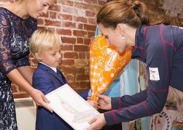 Leo Howard showing the Duchess of Cambridge his winning design last year Picture: Lloyd Images