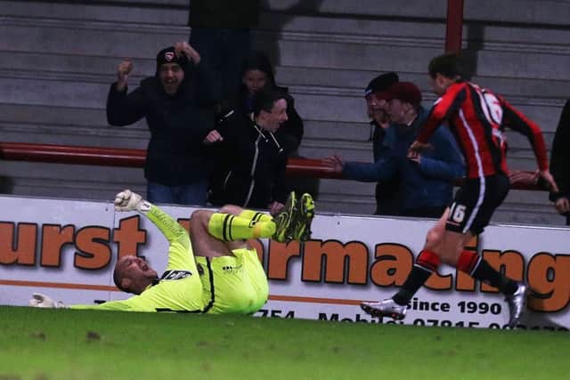 Morecambe's goalkeeper Barry Roche celebrates netting against Pompey. Picture: Joe Pepler