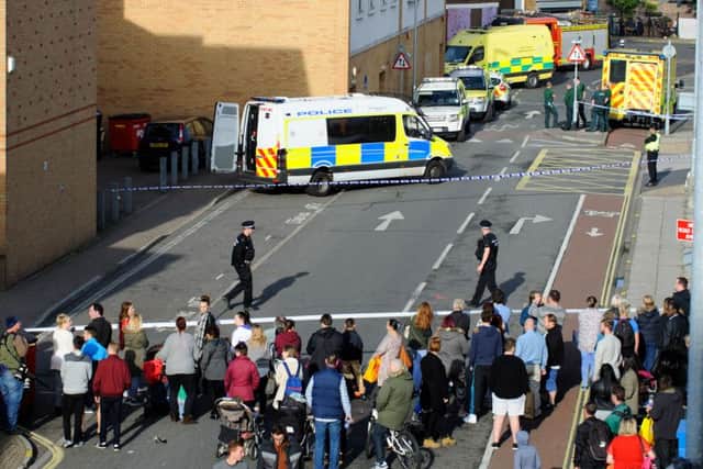 Police and emergency services attending the reports of a man with a knife in Virgin Media store in Commercial Road on October 31