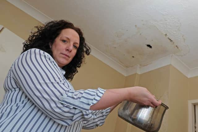 Navy wife Joanne Money with her dog Cookie who is in a running battle with the MoD over a water leak that is making life intolerable at her Gosport home  
Picture Ian Hargreaves  (160170-4)