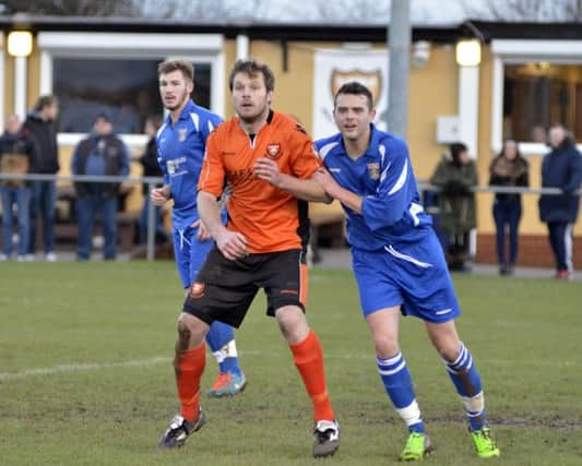 AFC Portchester midfielder Craig Hardy, centre    Picture: Neil Marshall