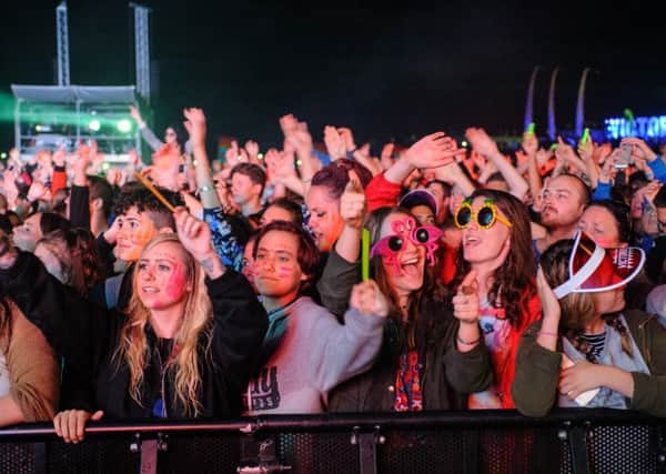 Music fans enjoy Tinie Tempah performing on the Castle Stage at the 2015 Victorious Festival. 

Picture: Allan Hutchings